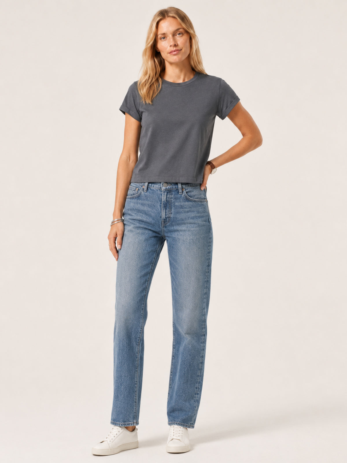 woman modeling a dark gray short-sleeve crewneck t-shirt
