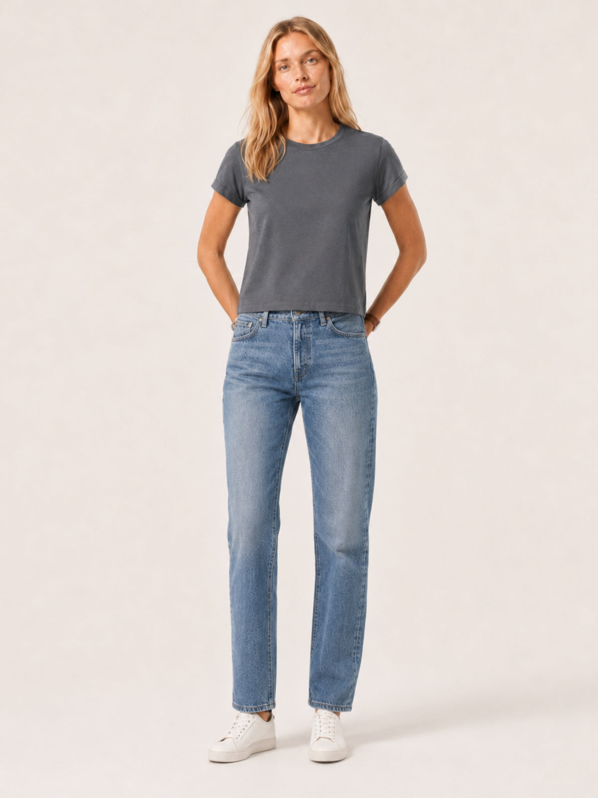 woman modeling a dark gray short-sleeve crewneck t-shirt