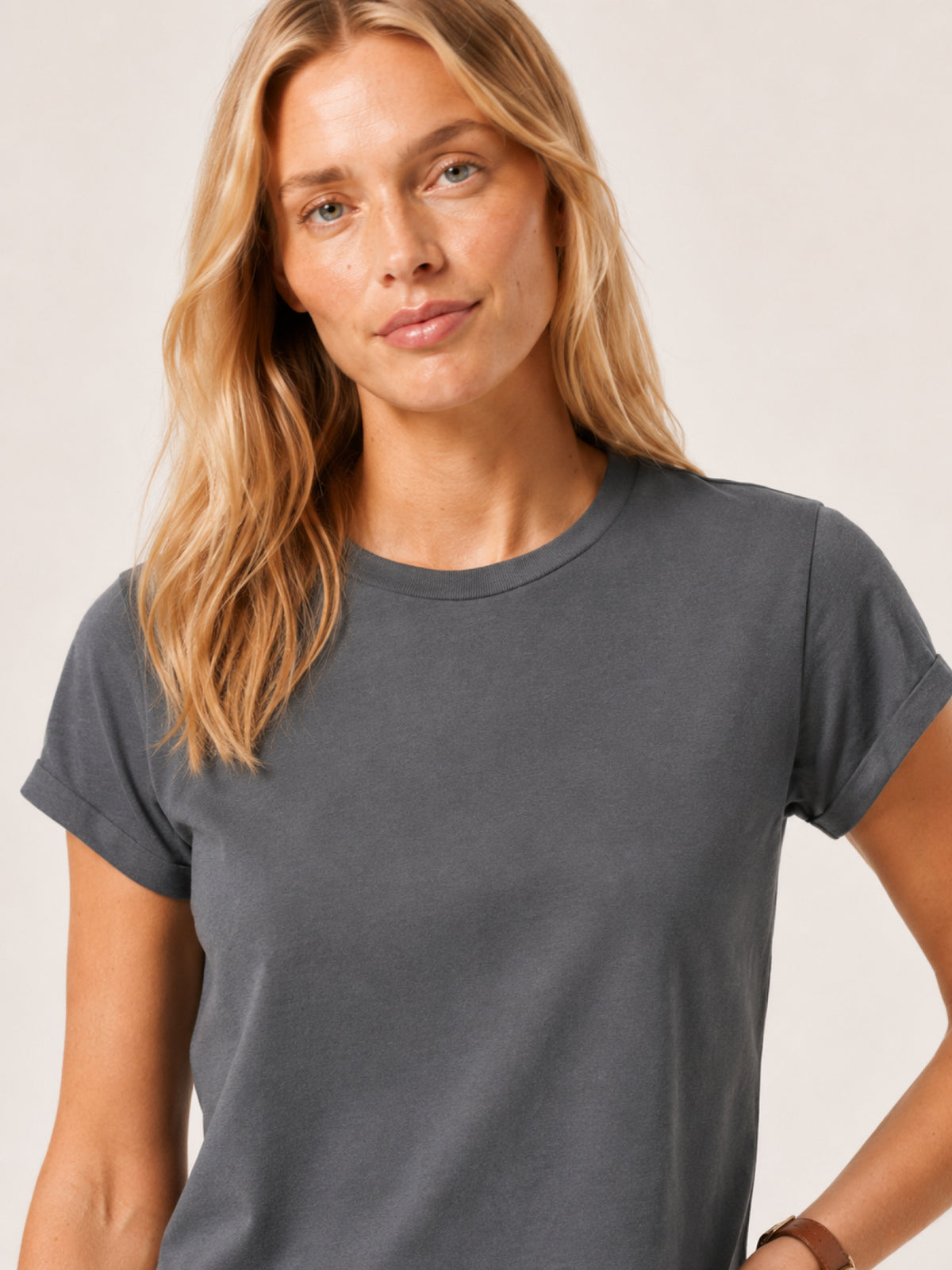 woman modeling a dark gray short-sleeve crewneck t-shirt