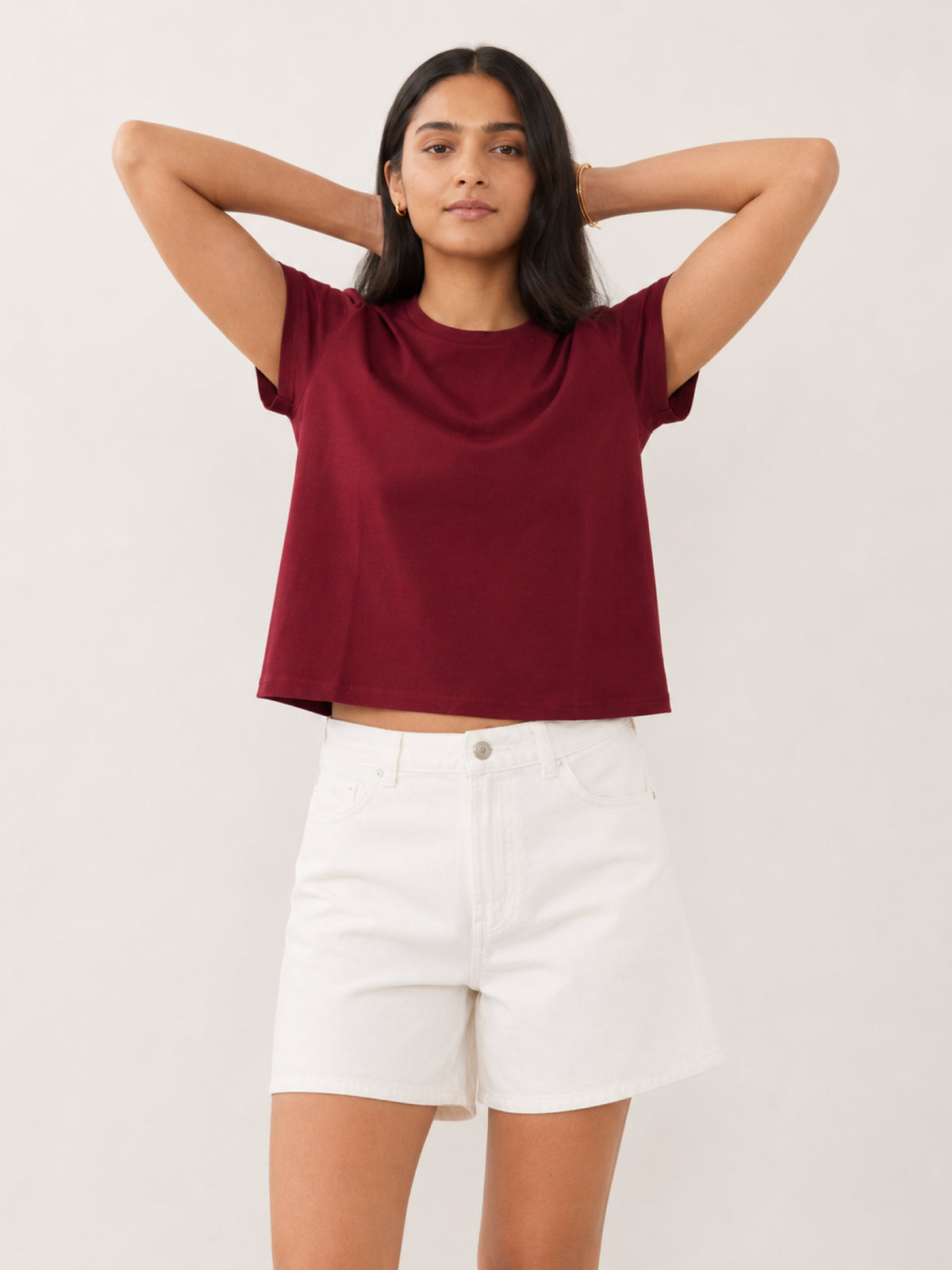 woman modeling a short-sleeve cropped t-shirt