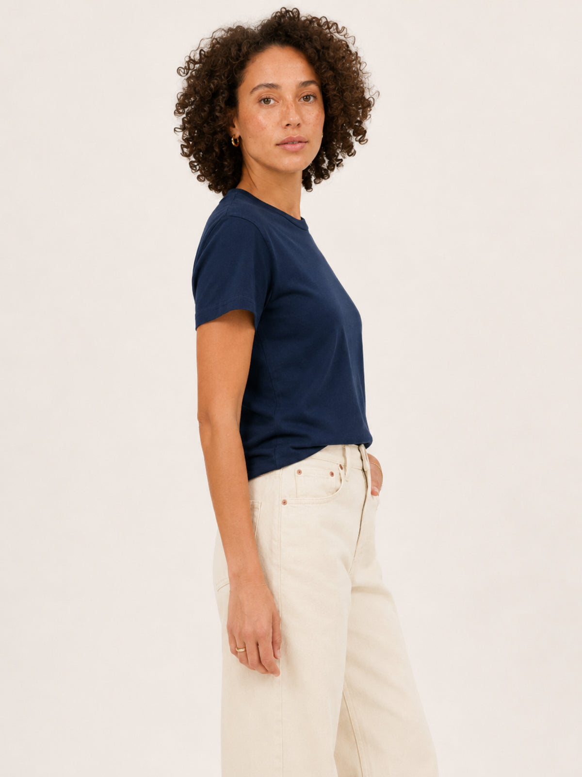wearing a navy blue short-sleeve crewneck t-shirt 