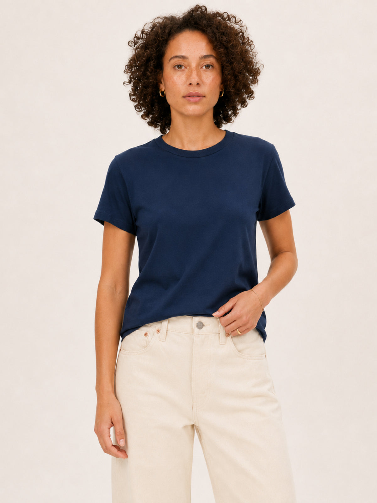 wearing a navy blue short-sleeve crewneck t-shirt