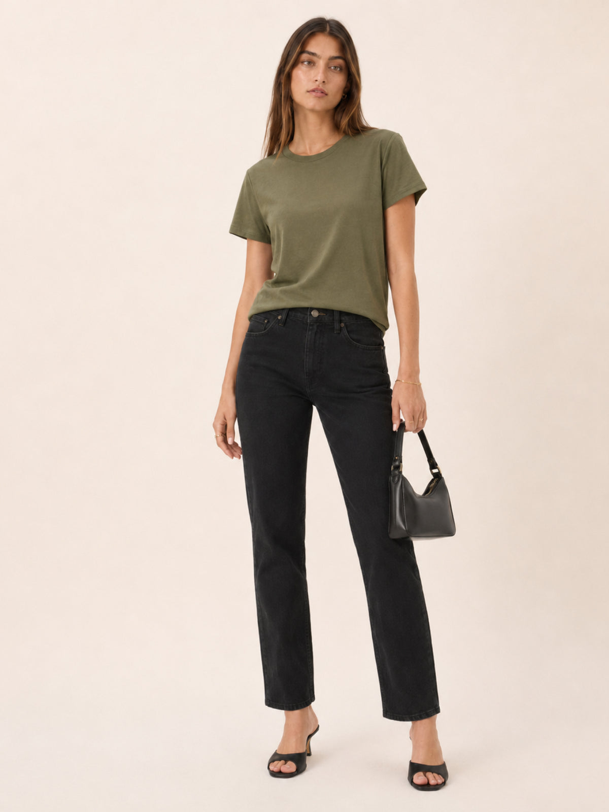 A woman modeling an olive green short-sleeve t-shir