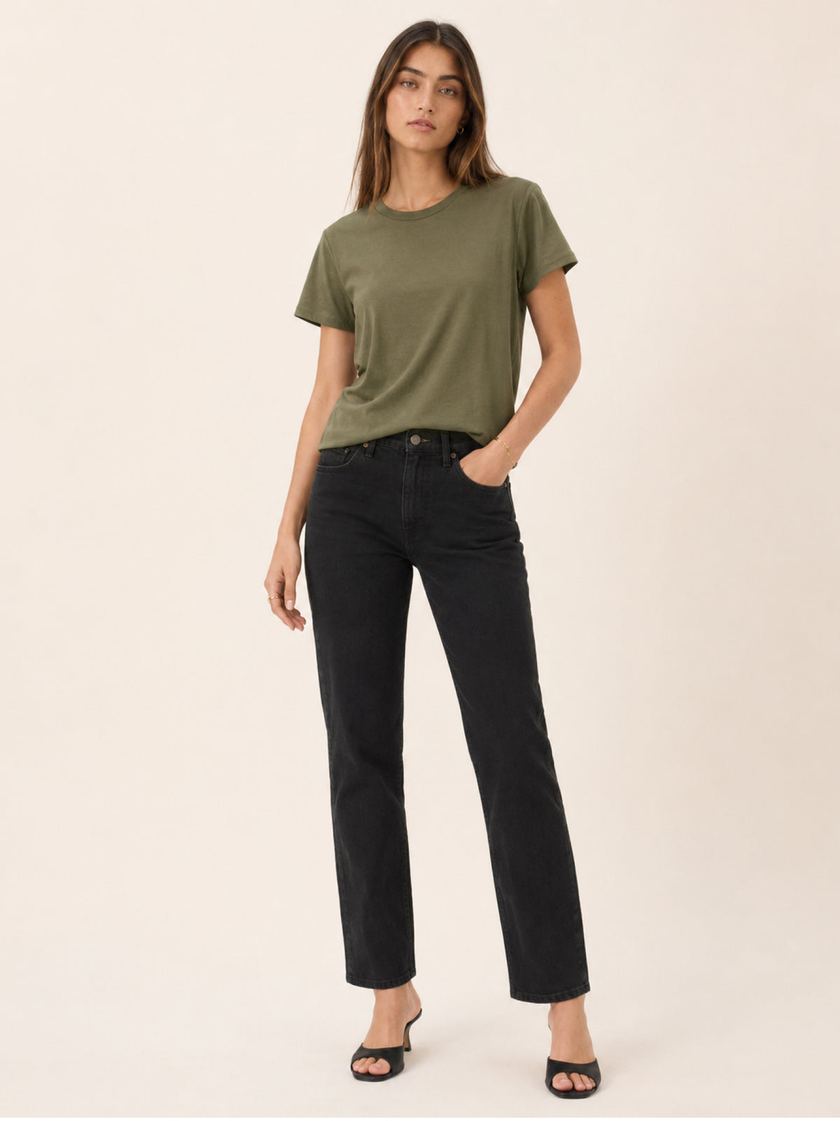 A woman modeling a short-sleeve olive green t-shirt